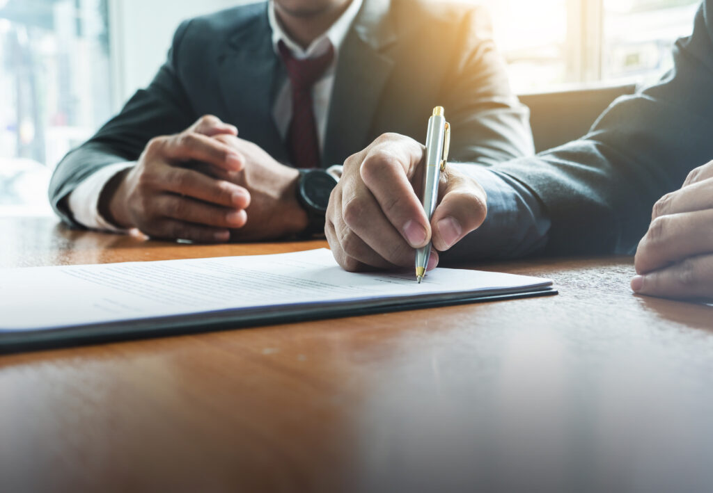 Power of Attorney document being signed 